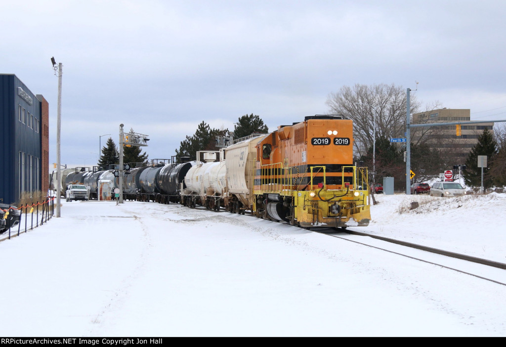 2019 rolls south along Shoreline Dr with cars for Webb Chemical